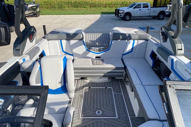 Slide: The Image of 2018 Nautique Super Air Nautique G21 interior with gray and blue seating. - 33