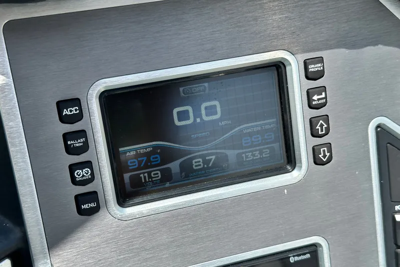 Slide: The Image of Dashboard of a 2018 MasterCraft XT23 boat displaying temperature and speed settings. - 28