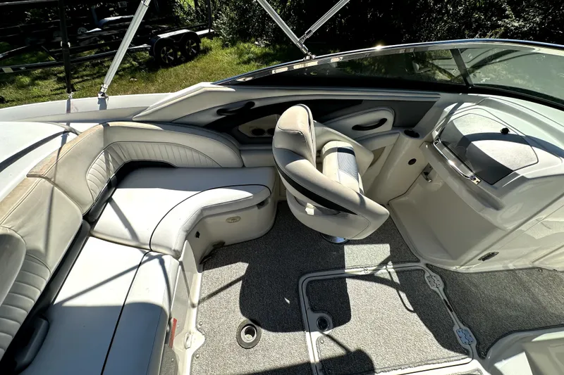 Slide: The Image of Interior of a 2007 Monterey 234FSX boat with seating and steering area. - 10