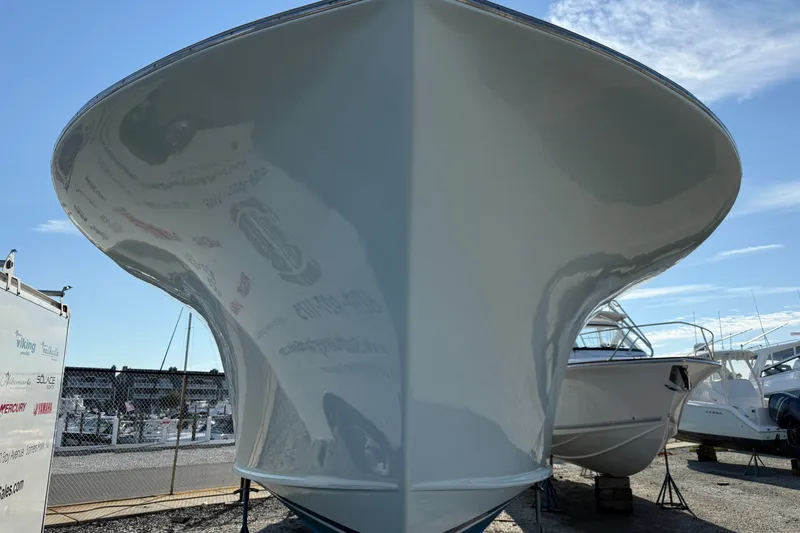Slide: The Image of Front view of a 2007 Outerbanks Express boat in a marina setting. - 2