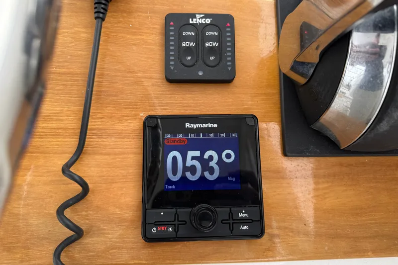 Slide: The Image of Boat dashboard with Raymarine display showing 053 degrees, Outerbanks Express 2007 model. - 11
