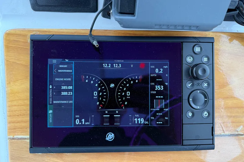 Slide: The Image of Digital dashboard display on a 2007 Outerbanks Express boat, showing engine and navigation data. - 10