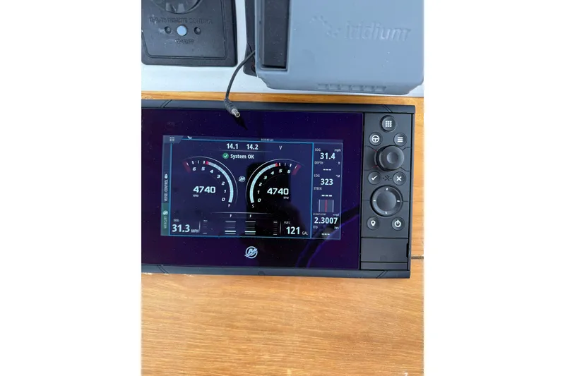 Slide: The Image of Digital dashboard display on a 2007 Outerbanks Express boat, showing speed and system status. - 9