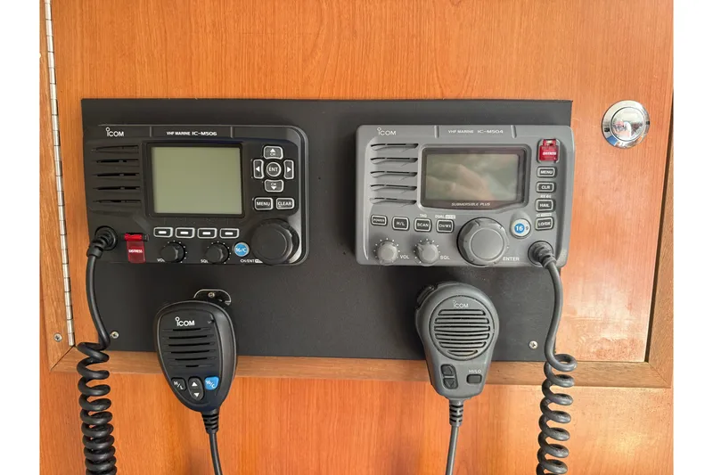 Slide: The Image of VHF marine radios on a 2007 Custom Carolina Express boat, mounted on a wooden panel. - 14