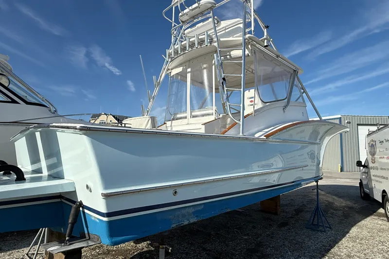 Slide: The Image of 2007 Outerbanks Express boat on display, featuring sleek design and elevated helm. - 4