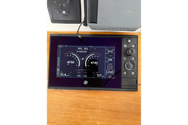 Slide: The Image of Digital dashboard display on a 2007 Outerbanks Express boat, showing speed and system status. - 8
