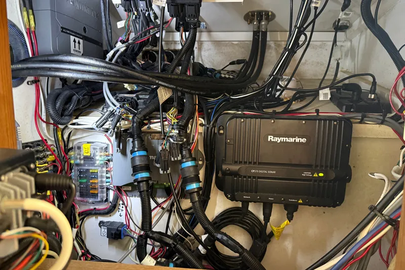 Slide: The Image of Boat electrical system with Raymarine CP370 sonar, wires, and fuse box in a 2007 Outerbanks Express. - 15