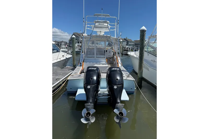 Slide: The Image of 2007 Outerbanks Express boat with dual 350 horsepower engines docked at marina. - 6