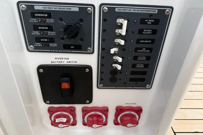Slide: The Image of Electrical control panel on a 2007 Outerbanks Express boat, featuring switches and indicators. - 17