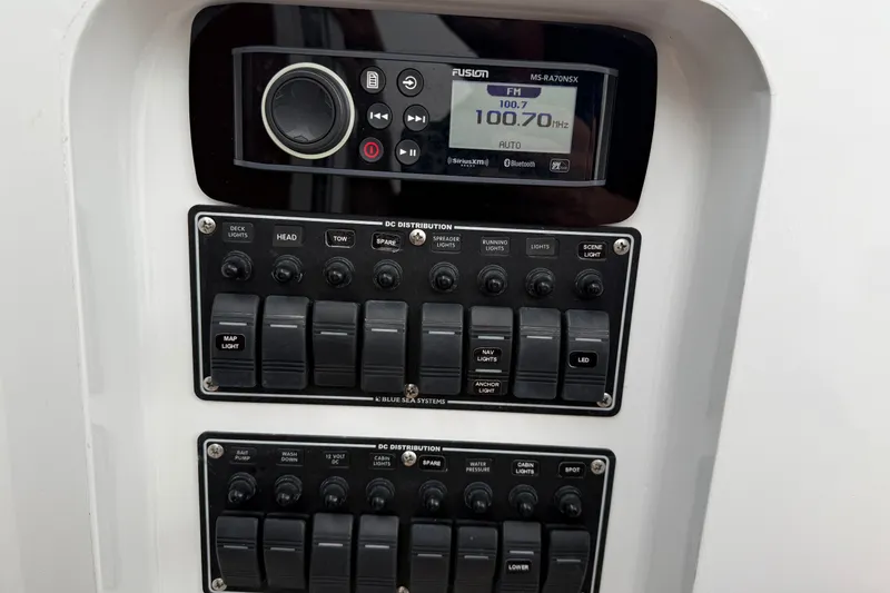 Slide: The Image of Control panel of a 2007 Outerbanks Express boat with radio and switchboard. - 16