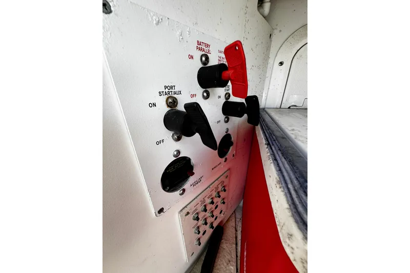 Slide: The Image of Control panel of a 2004 Formula 370 Super Sport boat, featuring switches and labels. - 33