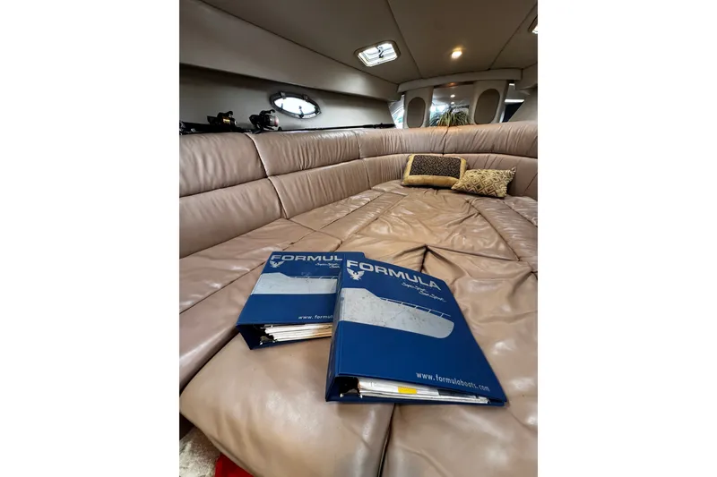 Slide: The Image of Luxurious interior of 2004 Formula 370 Super Sport yacht with leather seating and manuals. - 20