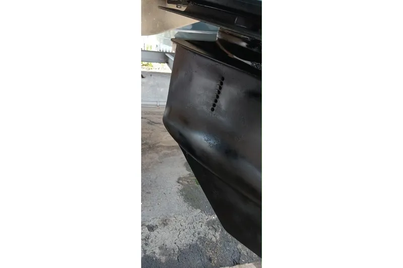 Slide: The Image of Close-up of a 2004 Formula 370 Super Sport boat hull detail. - 40