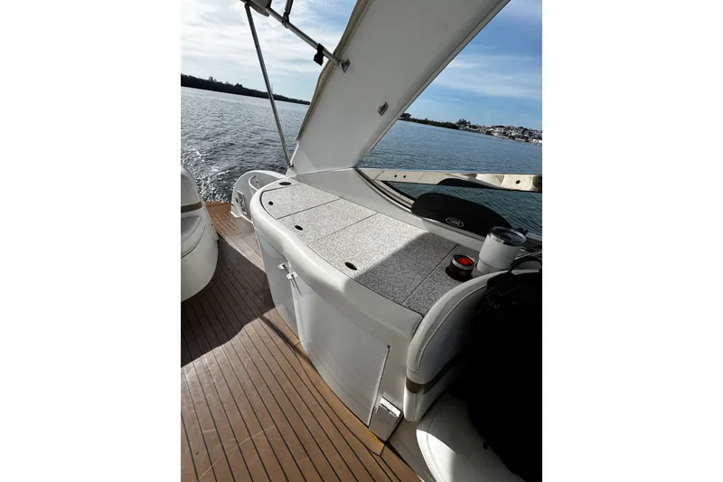 Slide: The Image of 2004 Formula 370 Super Sport boat interior with seating and water view. - 17