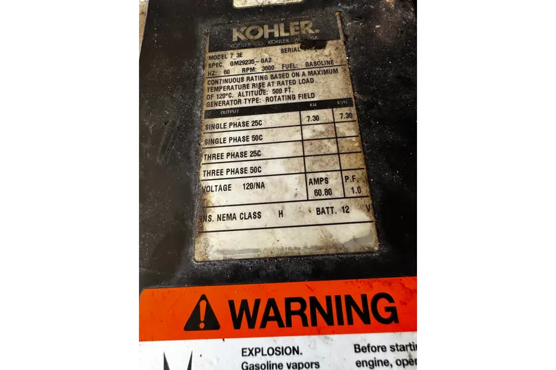 Slide: The Image of Label on Kohler generator with specifications and warning sign, related to Formula 370 Super Sport 2004. - 35