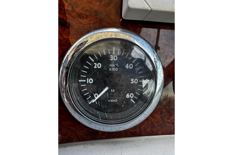 Slide: The Image of Close-up of a tachometer on a 2004 Formula 370 Super Sport boat dashboard. - 28