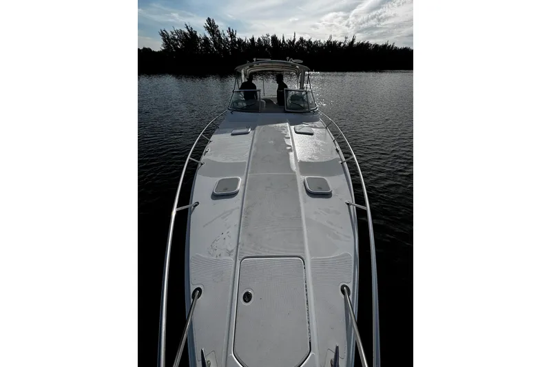 Slide: The Image of 2004 Formula 370 Super Sport boat on calm water, viewed from the bow. - 15