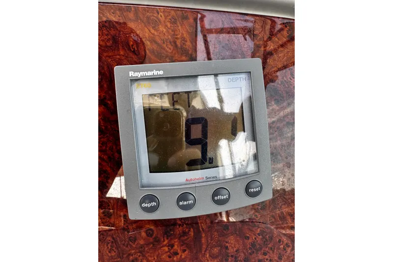 Slide: The Image of Raymarine depth gauge on 2004 Formula 370 Super Sport boat dashboard. - 26