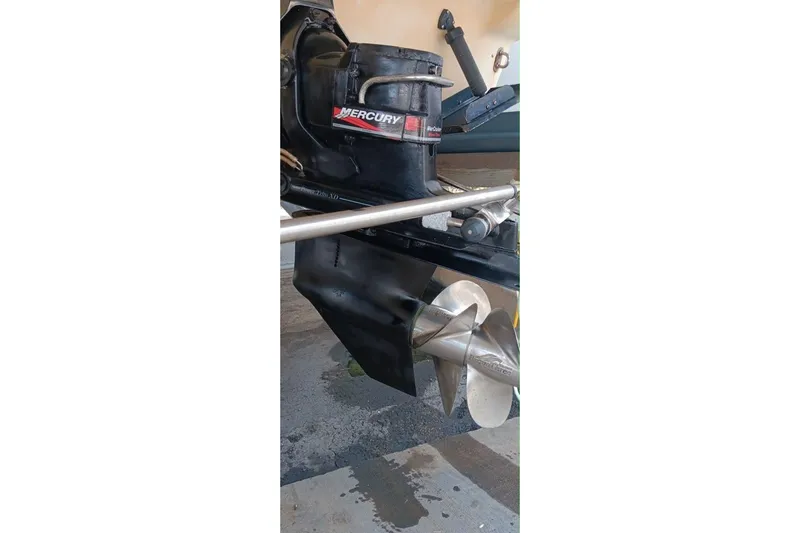 Slide: The Image of Close-up of a 2004 Formula 370 Super Sport boat's Mercury outdrive and propeller. - 38