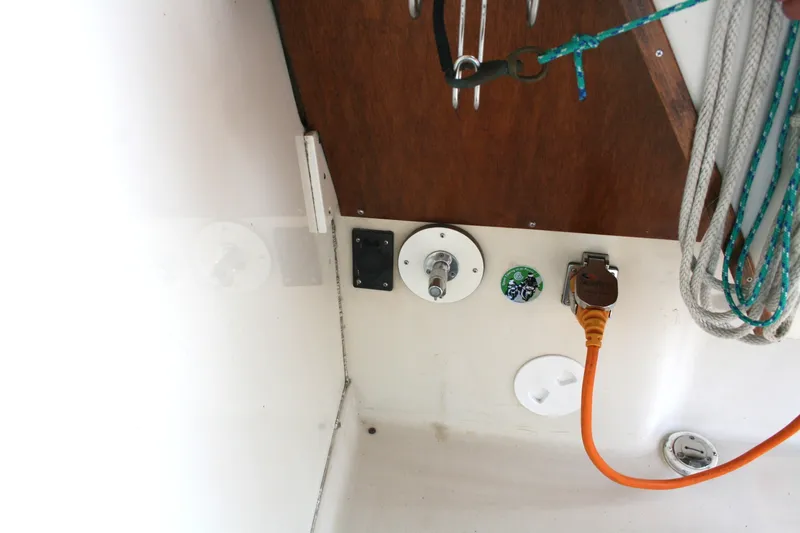 Slide: The Image of 1989 Silverton 34 Convertible boat interior with electrical connections and ropes. - 38