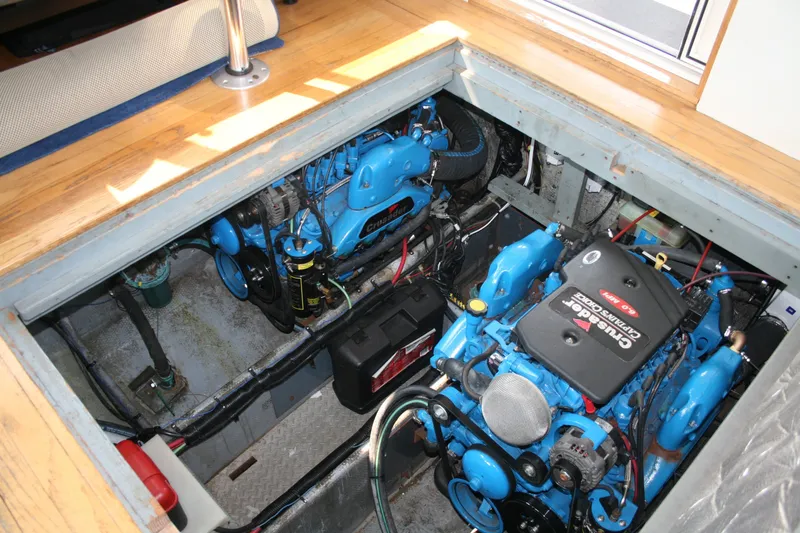 Slide: The Image of Engine compartment of a 1989 Silverton 34 Convertible boat, featuring Crusader engines. - 26