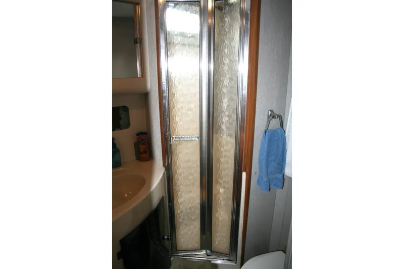 Slide: The Image of Bathroom interior of 1989 Silverton 34 Convertible yacht with shower and sink. - 22