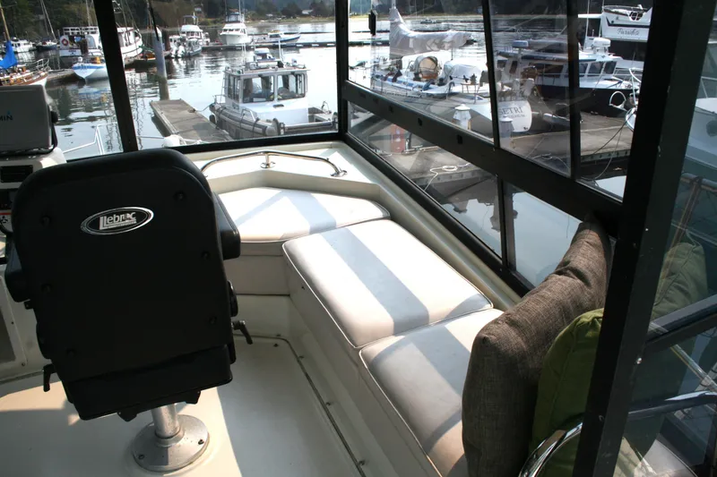 Slide: The Image of Interior view of 1989 Silverton 34 Convertible boat with seating and harbor view. - 8