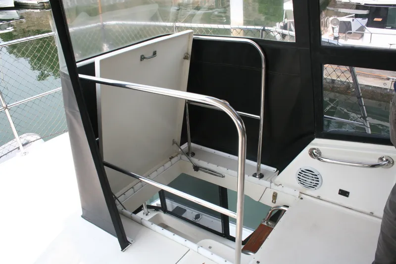Slide: The Image of Interior view of 1989 Silverton 34 Convertible yacht with open hatch and railing. - 3