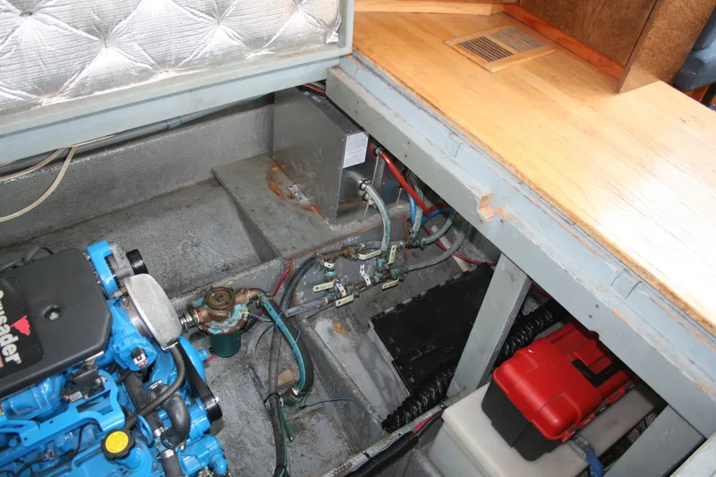 Slide: The Image of Engine compartment of a 1989 Silverton 34 Convertible boat, showcasing mechanical components. - 29