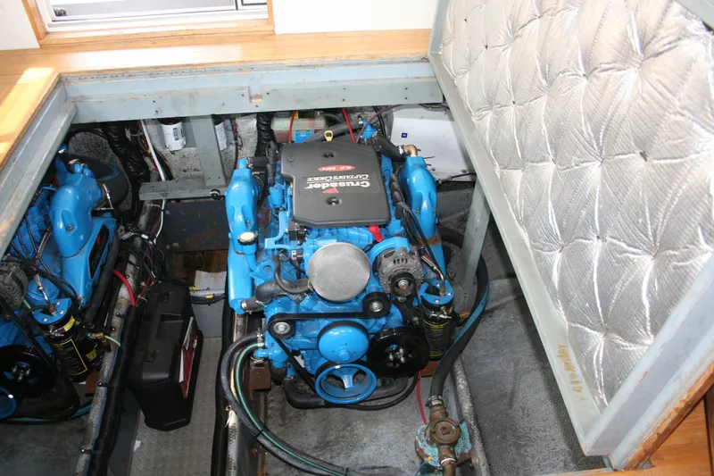 Slide: The Image of Engine compartment of a 1989 Silverton 34 Convertible boat, featuring Crusader engines. - 27