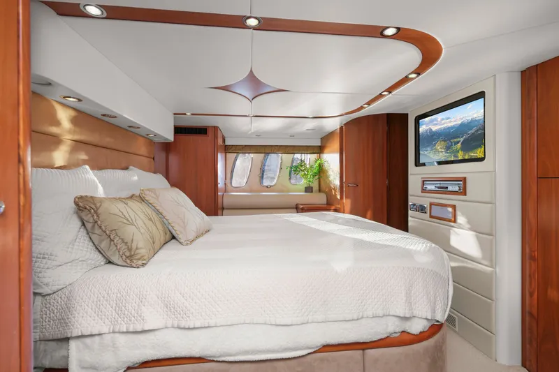 Slide: The Image of Luxurious bedroom interior of 2006 Sunseeker Predator 68 yacht with elegant wood accents. - 33
