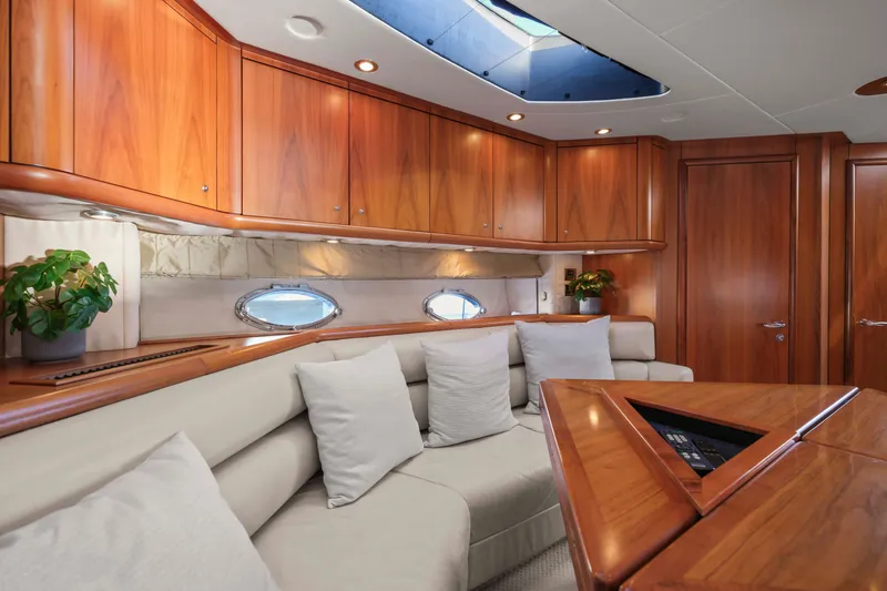 Slide: The Image of Luxurious interior of 2006 Sunseeker Predator 68 yacht with elegant wood finishes and plush seating. - 21