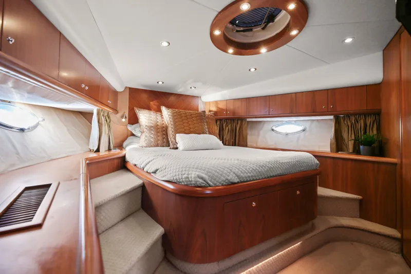 Slide: The Image of Luxurious cabin interior of 2006 Sunseeker Predator 68 yacht with elegant wood finish. - 24
