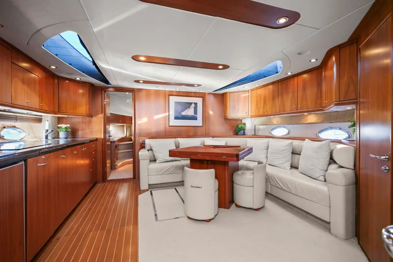 Slide: The Image of Luxurious interior of 2006 Sunseeker Predator 68 yacht with elegant wood finishes and plush seating. - 22