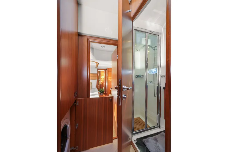Slide: The Image of Luxurious bathroom interior of 2006 Sunseeker Predator 68 yacht with wooden finishes. - 31
