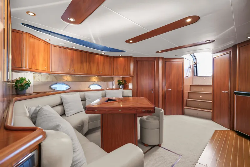 Slide: The Image of Luxurious interior of 2006 Sunseeker Predator 68 yacht with elegant wood finishes and plush seating. - 20