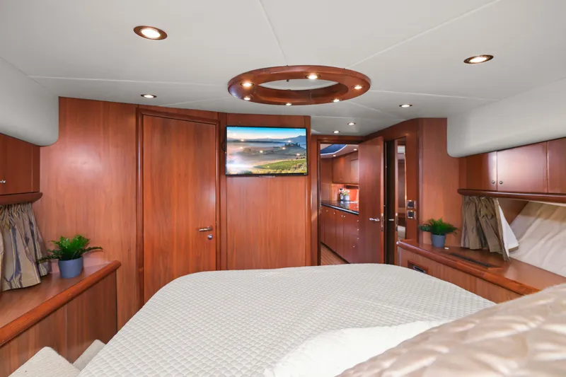 Slide: The Image of Luxurious interior of 2006 Sunseeker Predator 68 yacht with wood paneling and modern amenities. - 25