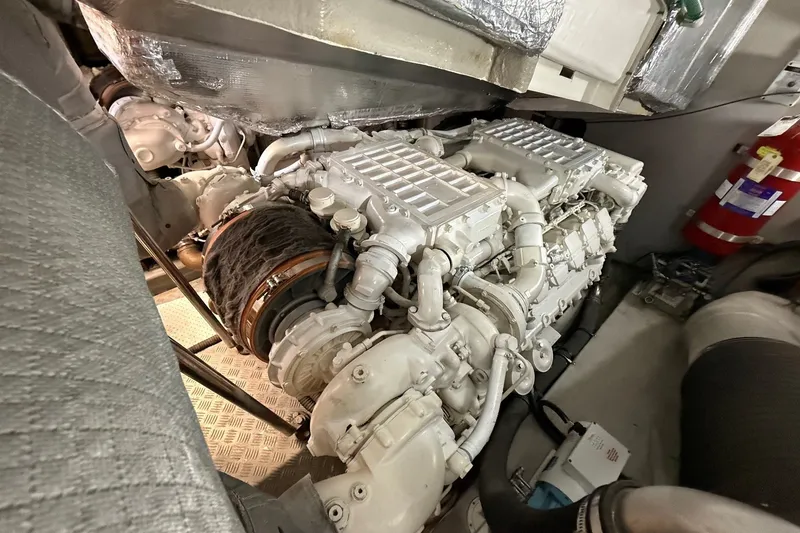 Slide: The Image of Engine room of a 2006 Sunseeker Predator 68 yacht, showcasing detailed machinery. - 40