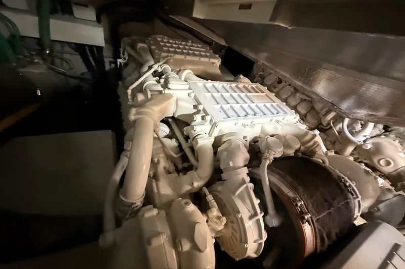 Slide: The Image of Engine room of a 2006 Sunseeker Predator 68 yacht, showcasing intricate machinery. - 41
