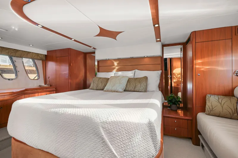 Slide: The Image of Luxurious cabin interior of 2006 Sunseeker Predator 68 yacht with elegant wood finishes. - 34