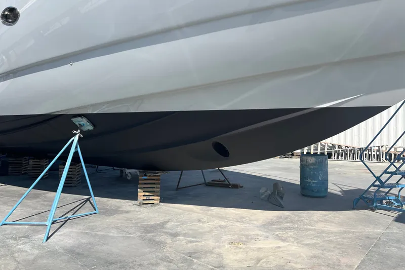 Slide: The Image of 2006 Sunseeker Predator 68 yacht hull on dry dock with support stands. - 43