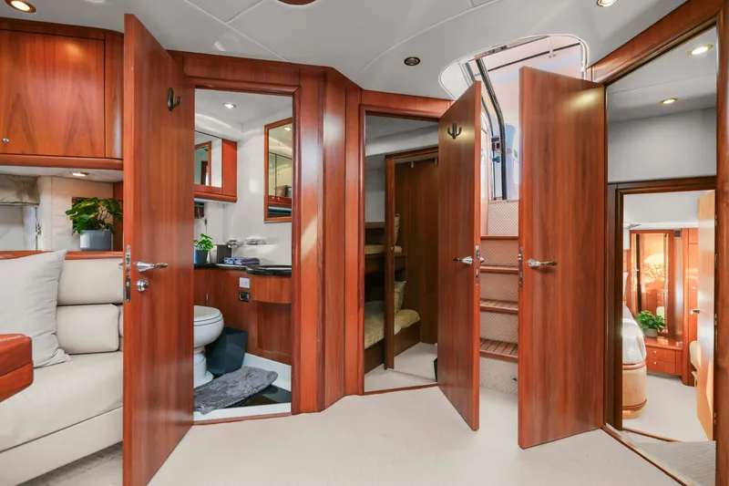 Slide: The Image of Luxurious interior of 2006 Sunseeker Predator 68 yacht with wooden finishes and modern amenities. - 30