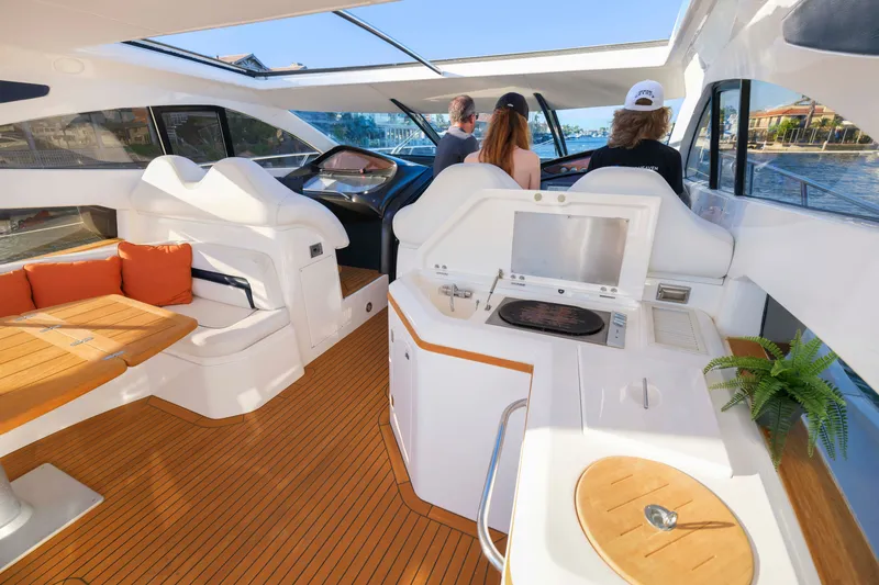 Slide: The Image of Luxurious interior of 2006 Sunseeker Predator 68 yacht with modern seating and helm. - 13