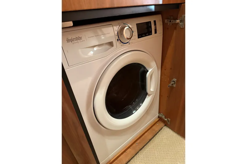 Slide: The Image of Splendide washer-dryer in Sunseeker Predator 68 yacht, 2006 model, wooden cabinet. - 32