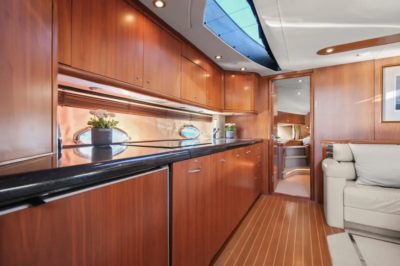 Slide: The Image of Luxurious interior of 2006 Sunseeker Predator 68 yacht with elegant wood cabinetry and modern design. - 18