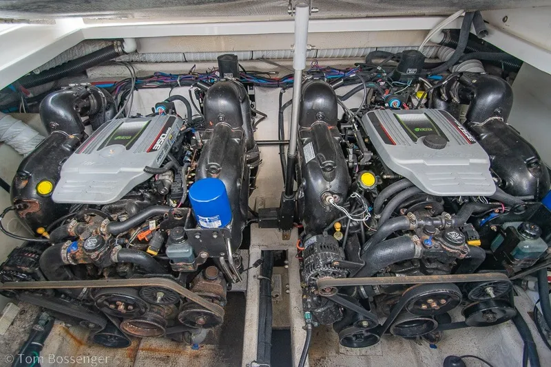 Slide: The Image of Engine compartment of a 2012 Rinker 310 Express Cruiser with dual engines. - 8