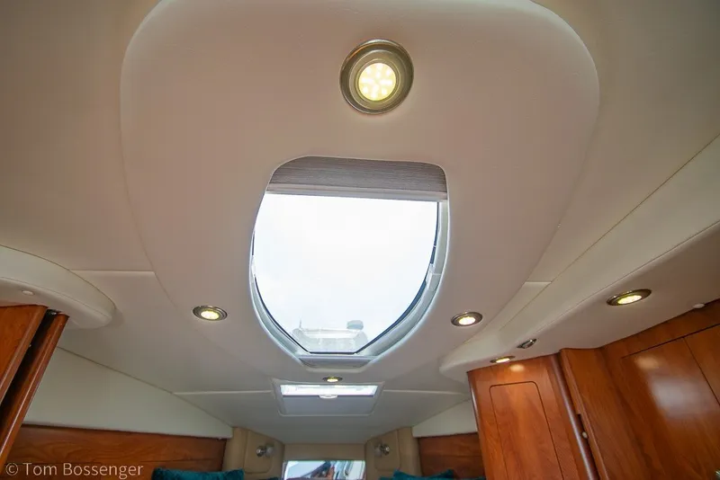 Slide: The Image of Interior view of 2012 Rinker 310 Express Cruiser with skylight and recessed lighting. - 27