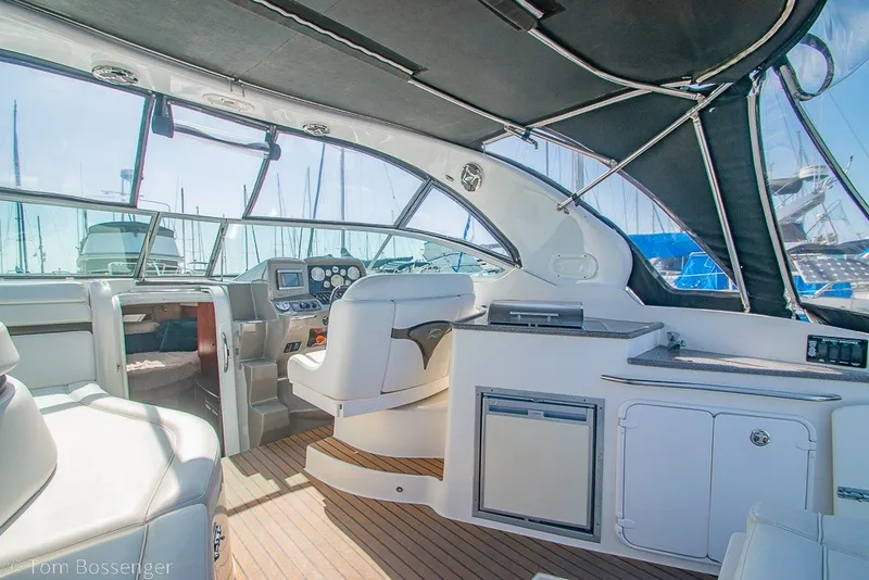 Slide: The Image of Interior of 2012 Rinker 310 Express Cruiser with modern helm and seating. - 30