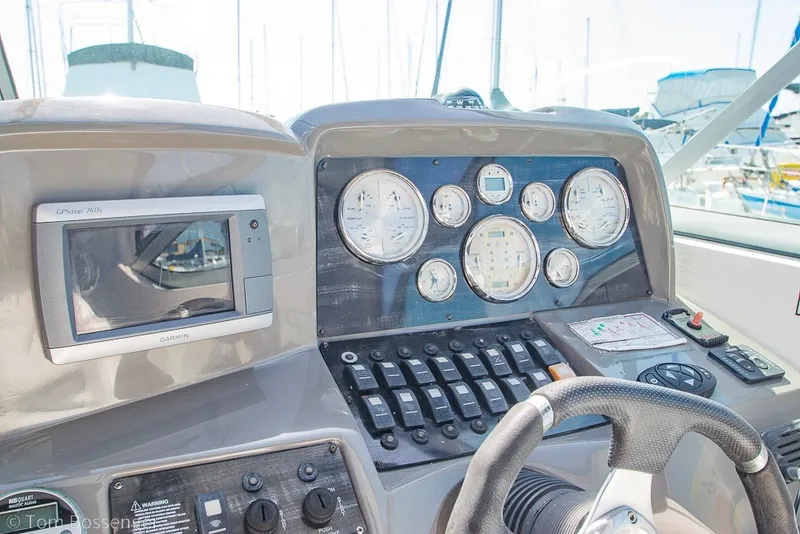 Slide: The Image of 2012 Rinker 310 Express Cruiser dashboard with gauges and Garmin GPS. - 35