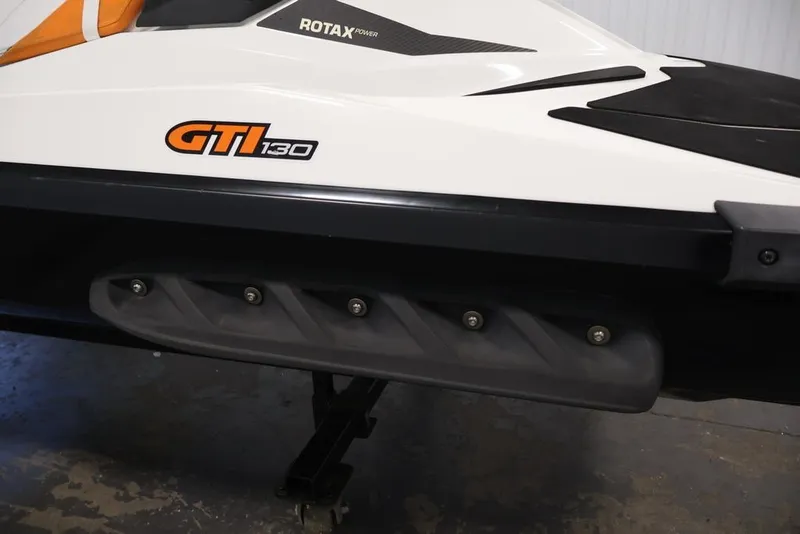 Slide: The Image of 2014 Sea-Doo GTI 130 jet ski with Rotax power, side view. - 5